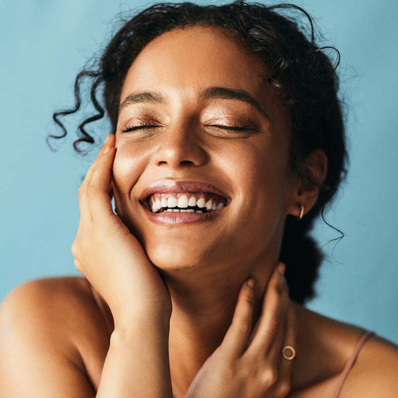 beautiful woman touching her face