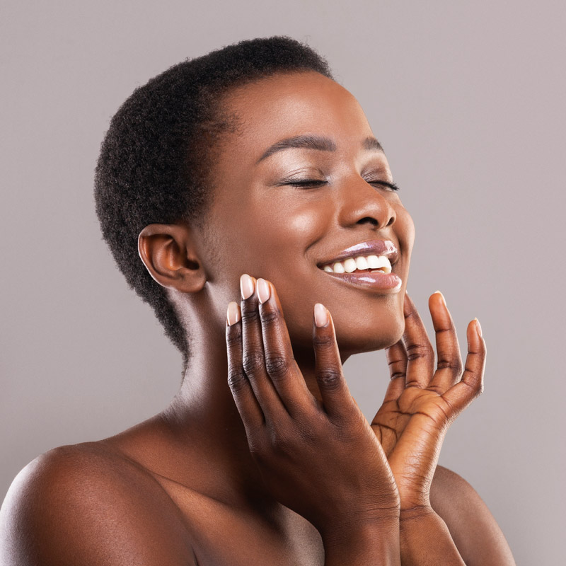 beautiful woman touching her face