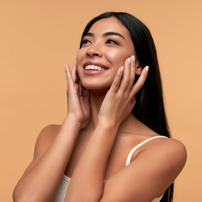 beautiful woman touching her face